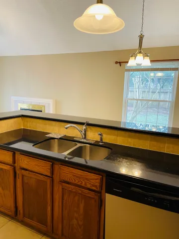 a kitchen with a sink and cabinets