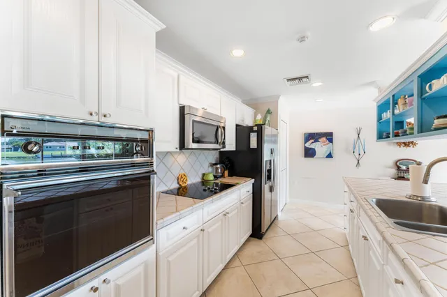 $875,000 | 8415 Pine Tree Lane, Lake Clarke Shores, FL 33406