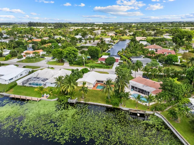 $875,000 | 8415 Pine Tree Lane, Lake Clarke Shores, FL 33406