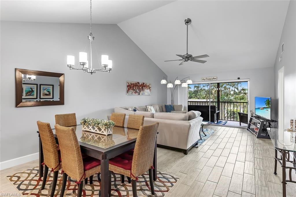 5695 Rattlesnake Hammock Road, Unit 202B Naples, FL 34113 - Photo 11 of 19 a view of a dining room with furniture window and outside view