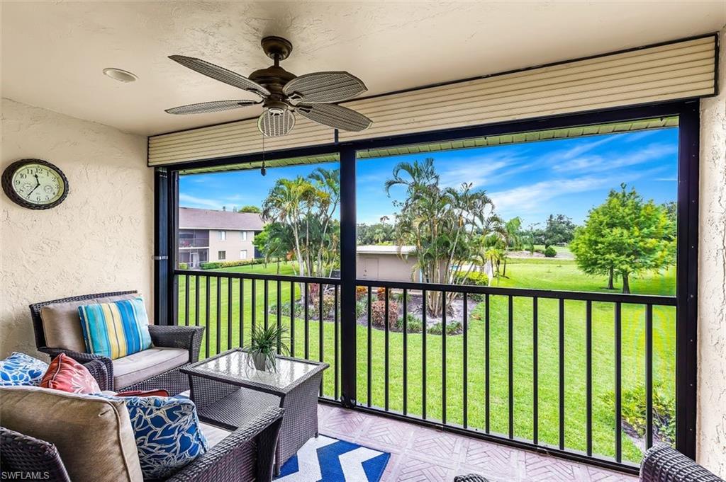 5695 Rattlesnake Hammock Road, Unit 202B Naples, FL 34113 - Photo 15 of 19 a view of a porch with furniture