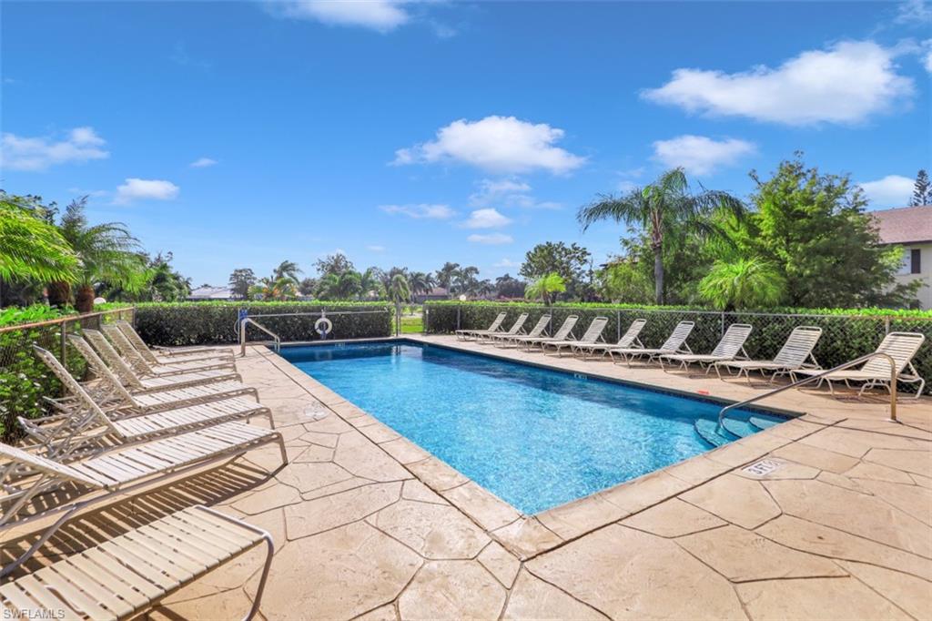 5695 Rattlesnake Hammock Road, Unit 202B Naples, FL 34113 - Photo 17 of 19 a view of swimming pool with lounge chair
