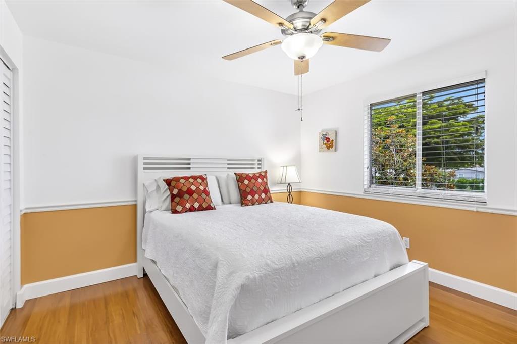 5695 Rattlesnake Hammock Road, Unit 202B Naples, FL 34113 - Photo 7 of 19 a bedroom with a bed and a window