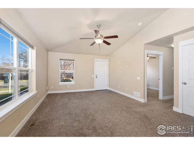 a bathroom with a granite countertop sink toilet and a mirror