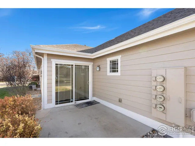 a kitchen with stainless steel appliances granite countertop a refrigerator a stove a sink and a microwave