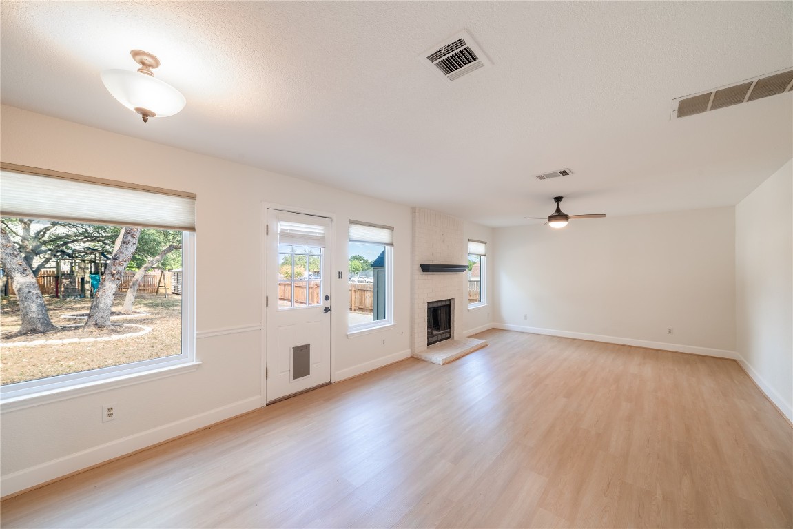 1201 Deer Grove Drive Cedar Park, TX 78613 - Photo 12 of 35 wooden floor in an empty room with a window