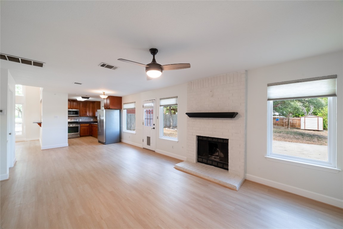 1201 Deer Grove Drive Cedar Park, TX 78613 - Photo 13 of 35 an empty room with furniture and a fireplace