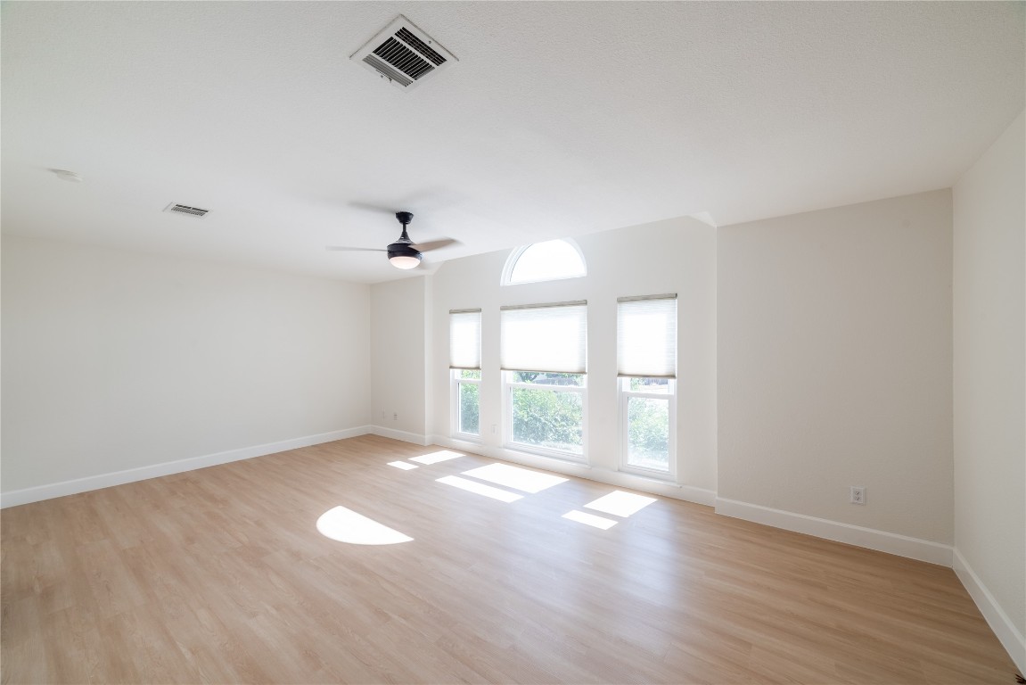 1201 Deer Grove Drive Cedar Park, TX 78613 - Photo 15 of 35 wooden floor in an empty room with a window