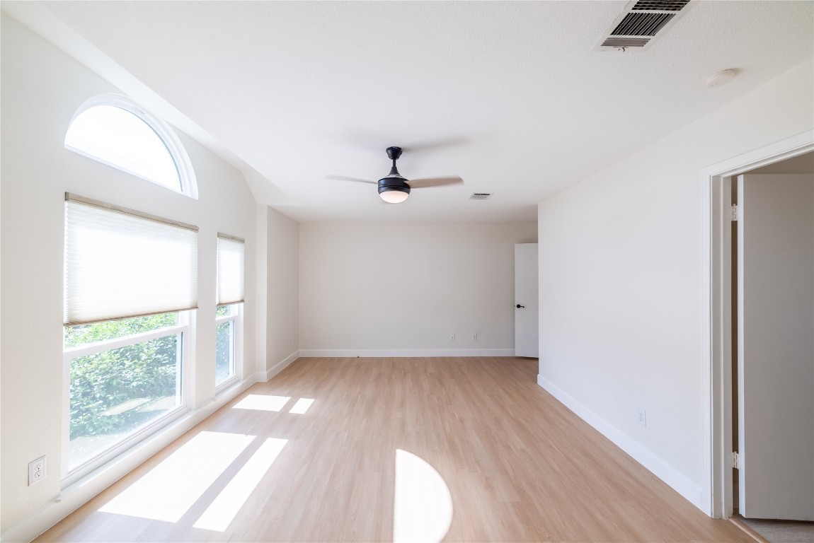 1201 Deer Grove Drive Cedar Park, TX 78613 - Photo 18 of 35 wooden floor in an empty room with a window