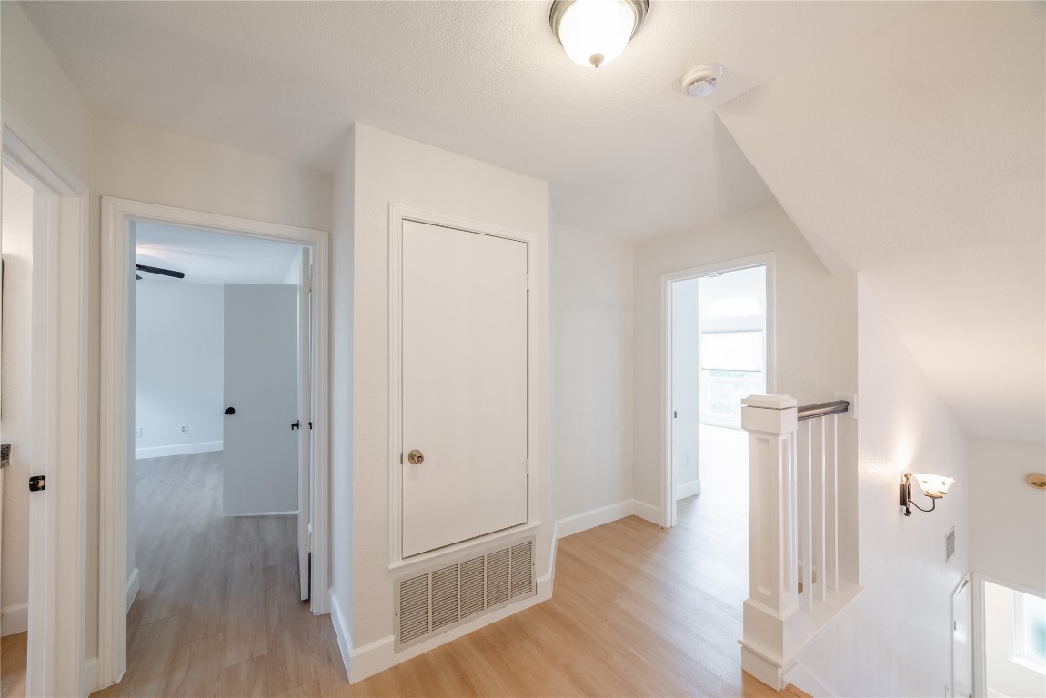 1201 Deer Grove Drive Cedar Park, TX 78613 - Photo 27 of 35 a view of a hallway with wooden floor and staircase