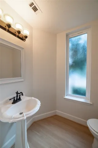 a bathroom with a sink and a toilet