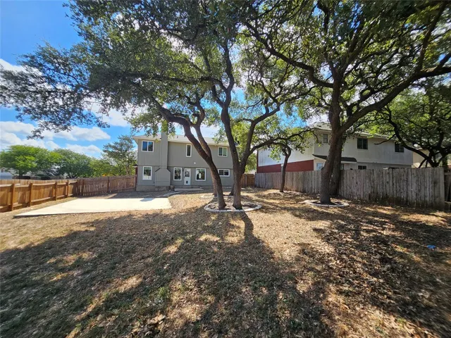 a view of a yard with a tree