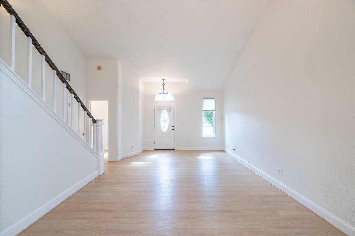 1201 Deer Grove Drive Cedar Park, TX 78613 - Photo 6 of 35 a view of a room with wooden floor and stairs
