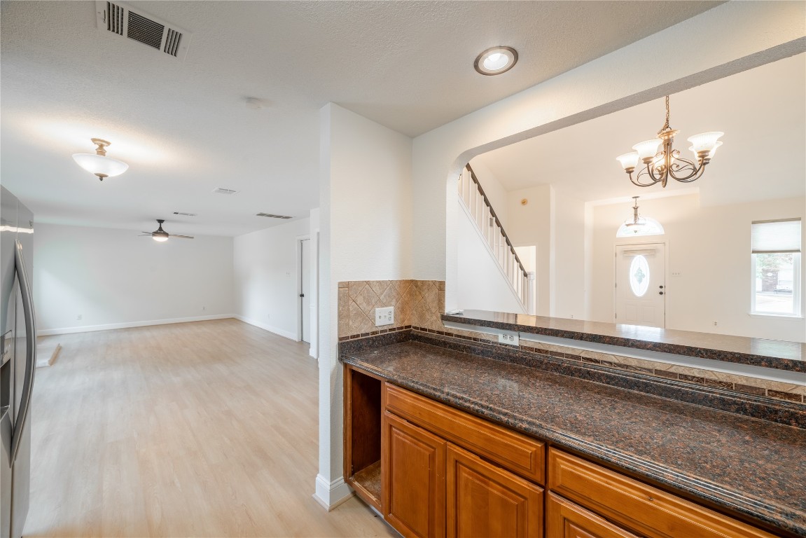 1201 Deer Grove Drive Cedar Park, TX 78613 - Photo 10 of 35 a view of a kitchen cabinets and chandelier