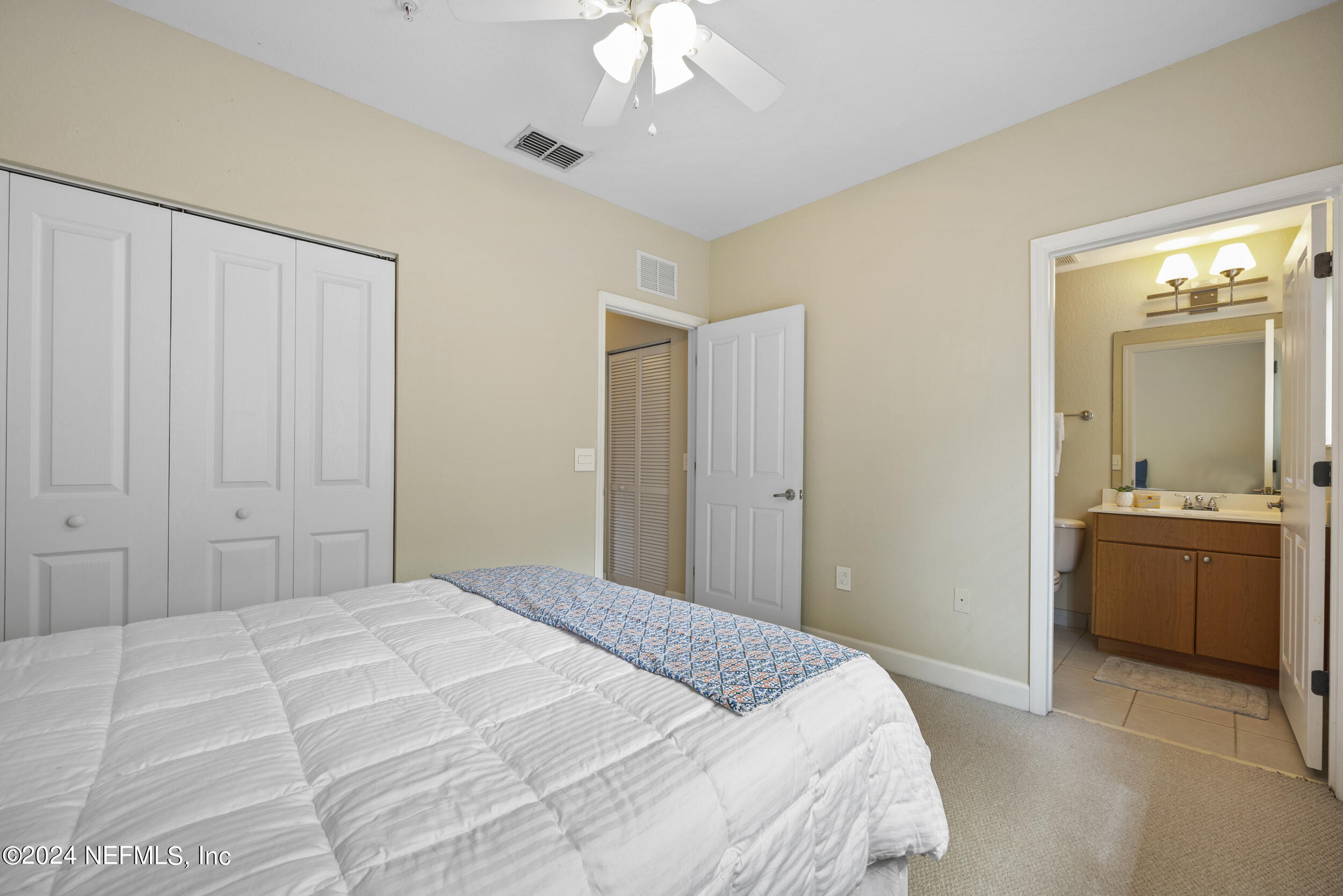 9745 Touchton Road, Unit 924 Jacksonville, FL 32246 - Photo 14 of 24 Secondary bedroom with en suite bathroom
