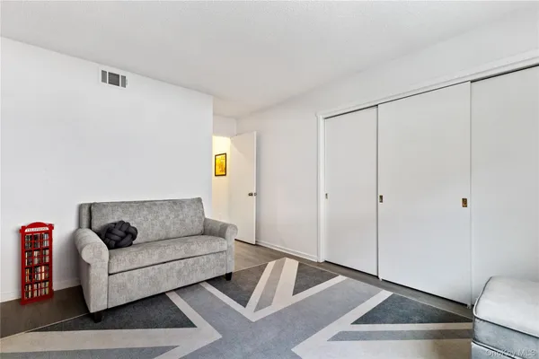 a living room with furniture and a rug