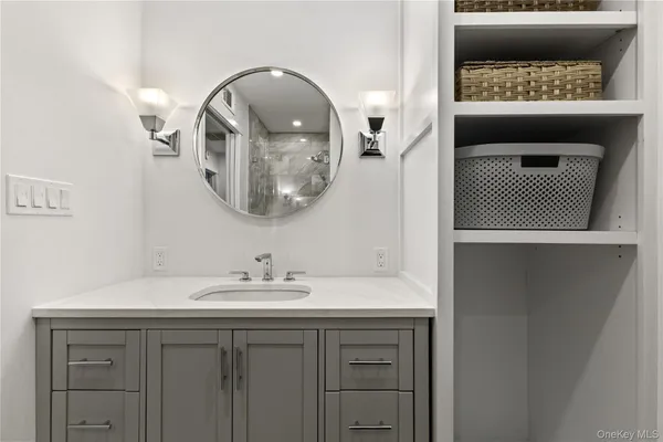 a bathroom with a sink and a mirror