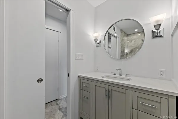 a bathroom with a sink and a mirror