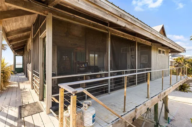 a balcony with furniture and wooden floor