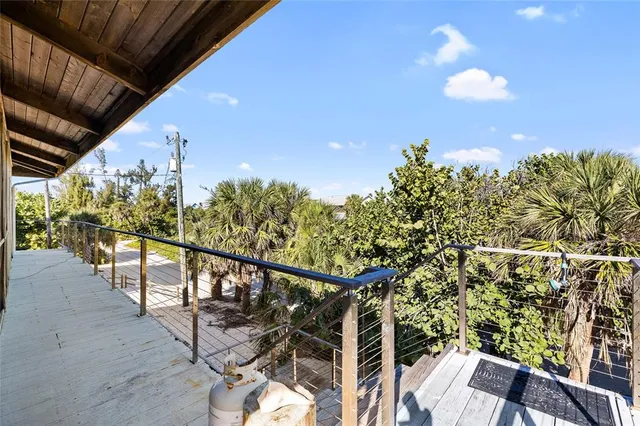 a view of a kitchen with stainless steel appliances granite countertop lots of counter top space