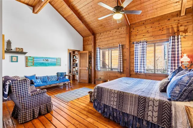 a bedroom with furniture and a window