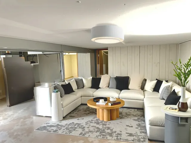 a living room with furniture and a rug