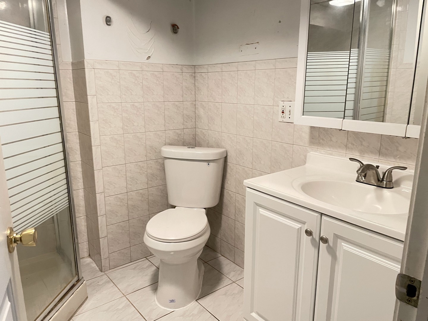 3909 West 71st Street Chicago, IL 60629 - Photo 13 of 16 a bathroom with a sink toilet and shower