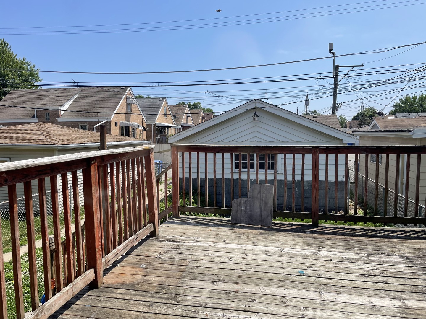 3909 West 71st Street Chicago, IL 60629 - Photo 15 of 16 a view of a house with a wooden fence