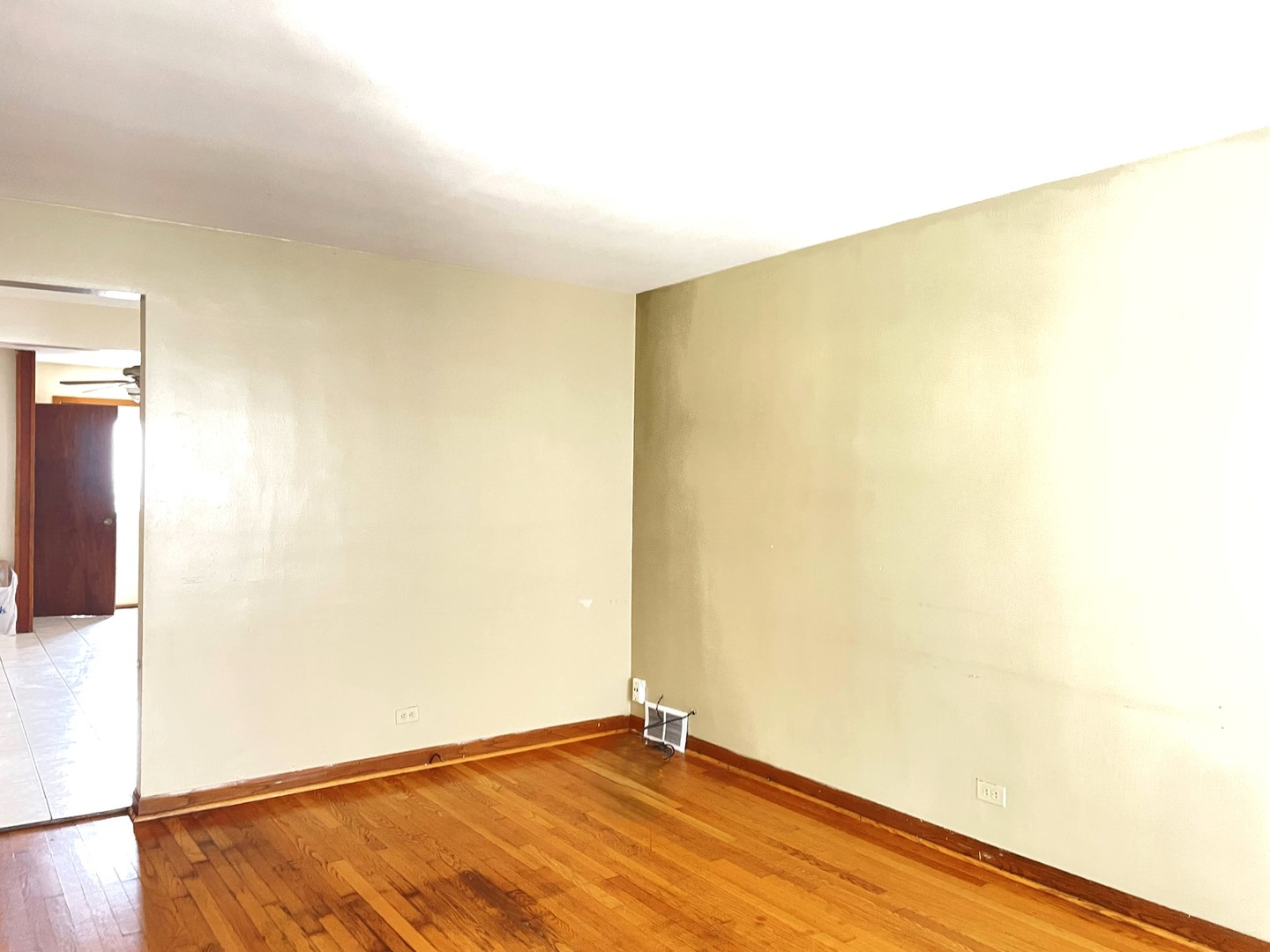 3909 West 71st Street Chicago, IL 60629 - Photo 2 of 16 a view of empty room with wooden floor