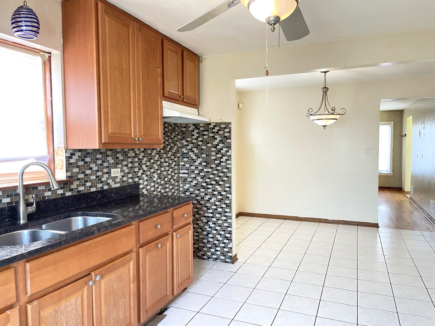 3909 West 71st Street Chicago, IL 60629 - Photo 8 of 16 a view of a kitchen with a sink and cabinets