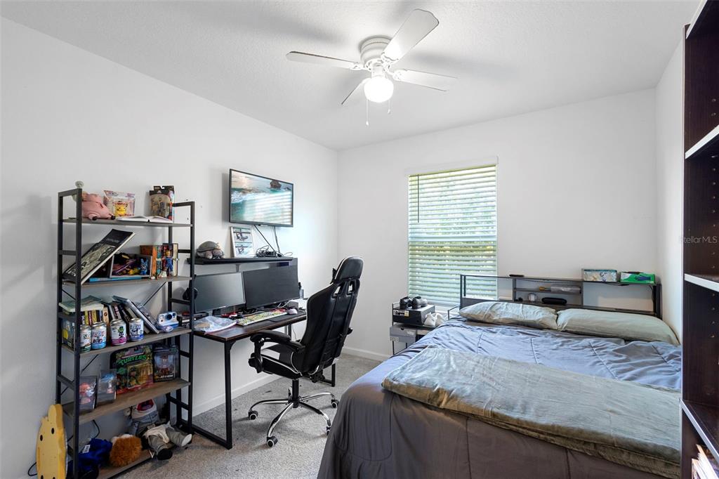 866 Spring Palms Loop Orlando, FL 32828 - Photo 18 of 26 a view of a workspace with furniture and a window