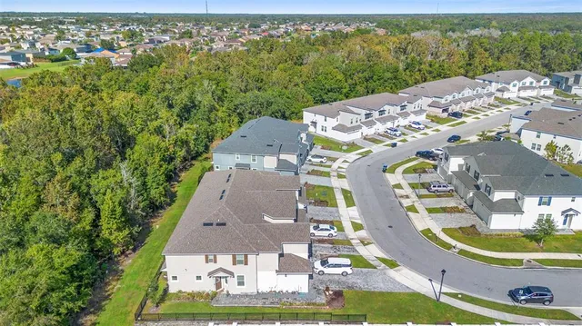 an aerial view of a house with a garden