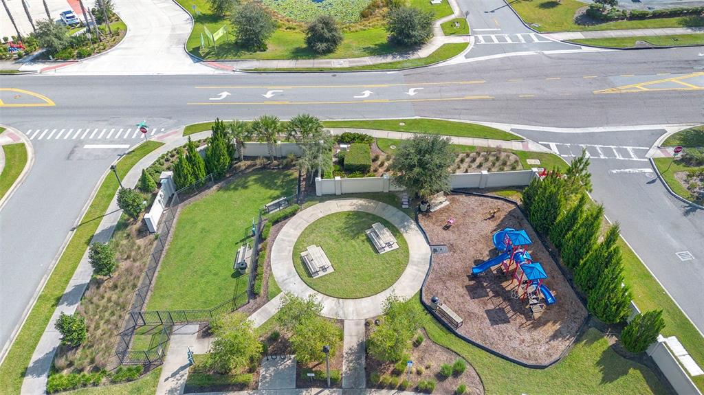 866 Spring Palms Loop Orlando, FL 32828 - Photo 25 of 26 a view of swimming pool with a garden