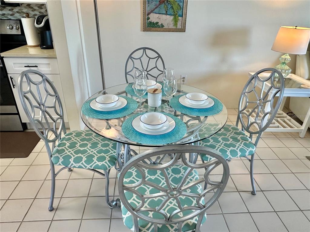 5915 Sea Ranch Drive, Unit 711 Hudson, FL 34667 - Photo 11 of 85 a view of a dining room that has a table and chairs