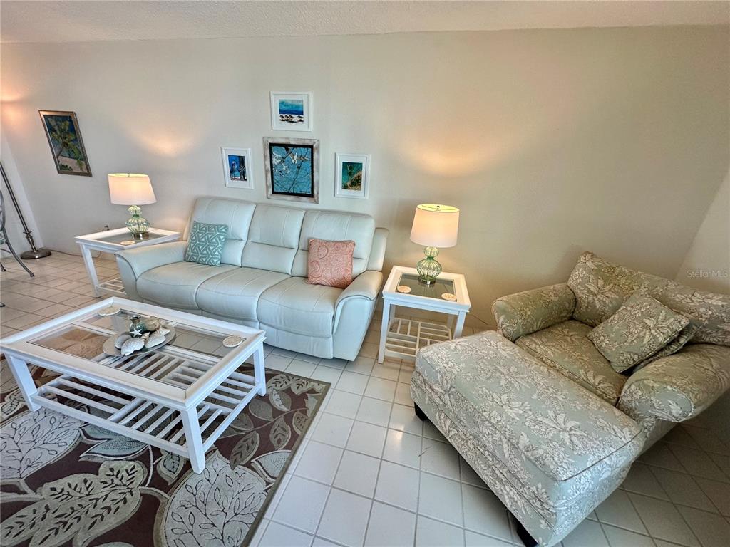 5915 Sea Ranch Drive, Unit 711 Hudson, FL 34667 - Photo 14 of 85 a living room with furniture and a couch