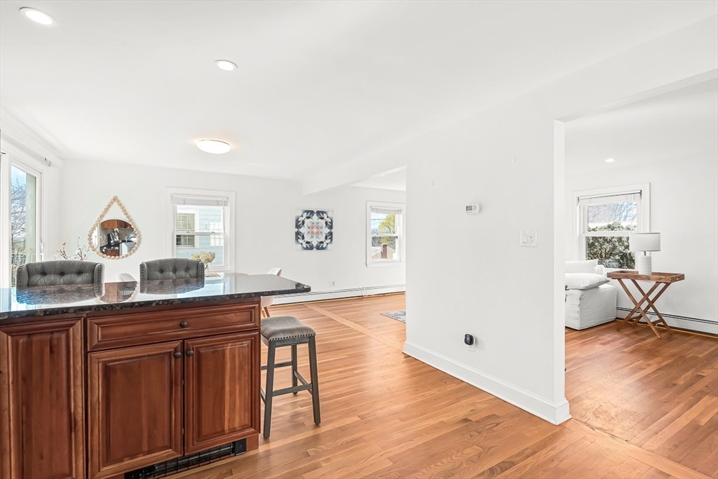 104 Wendell Street Winchester, MA 01890 - Photo 18 of 42 a view living room with stainless steel appliances granite countertop a sink and a wooden floor