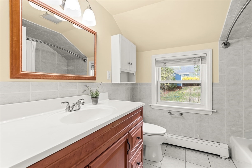 104 Wendell Street Winchester, MA 01890 - Photo 24 of 42 a bathroom with a sink a toilet and a mirror