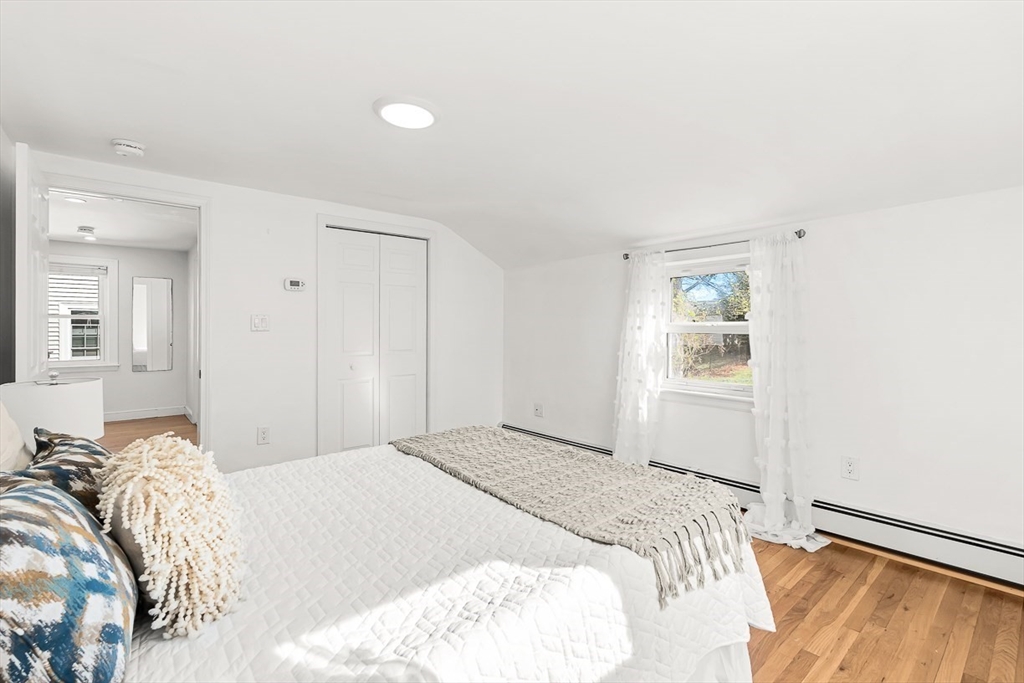 104 Wendell Street Winchester, MA 01890 - Photo 26 of 42 a bedroom with a bed and a window