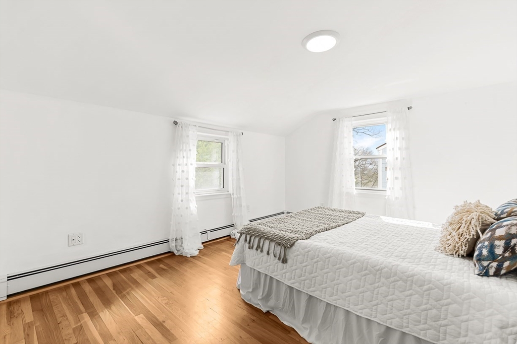 104 Wendell Street Winchester, MA 01890 - Photo 27 of 42 a bedroom with a bed and a window
