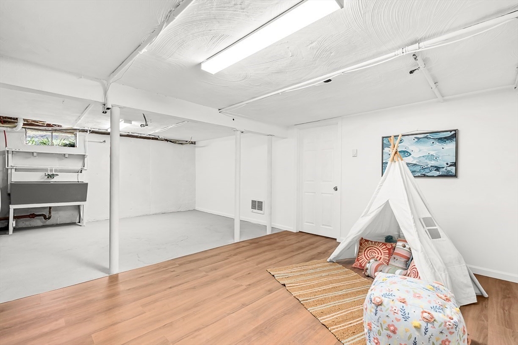 104 Wendell Street Winchester, MA 01890 - Photo 31 of 42 a room that has a bed and a walk in closet