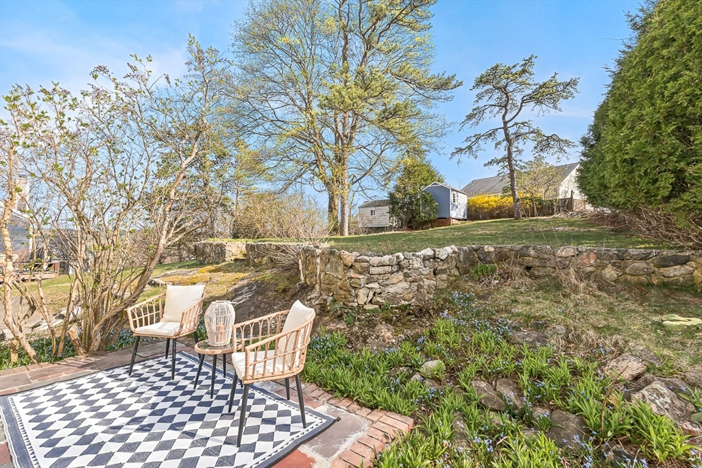 104 Wendell Street Winchester, MA 01890 - Photo 33 of 42 a view of a backyard with a tree