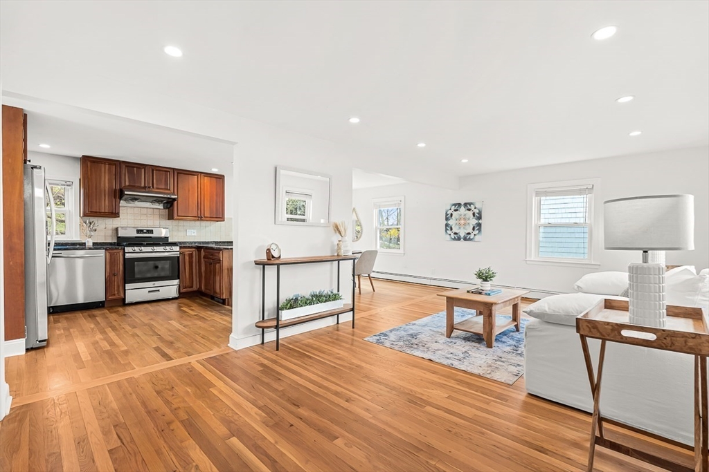 104 Wendell Street Winchester, MA 01890 - Photo 8 of 42 a living room with stainless steel appliances furniture and a kitchen view