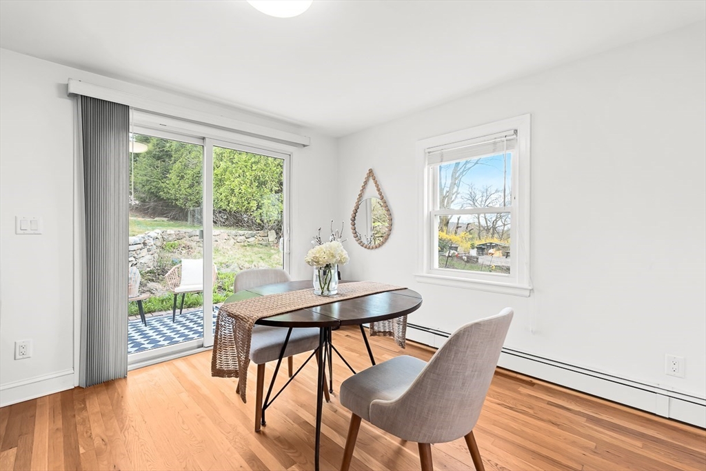 104 Wendell Street Winchester, MA 01890 - Photo 10 of 42 a view of a dining room with furniture window and wooden floor