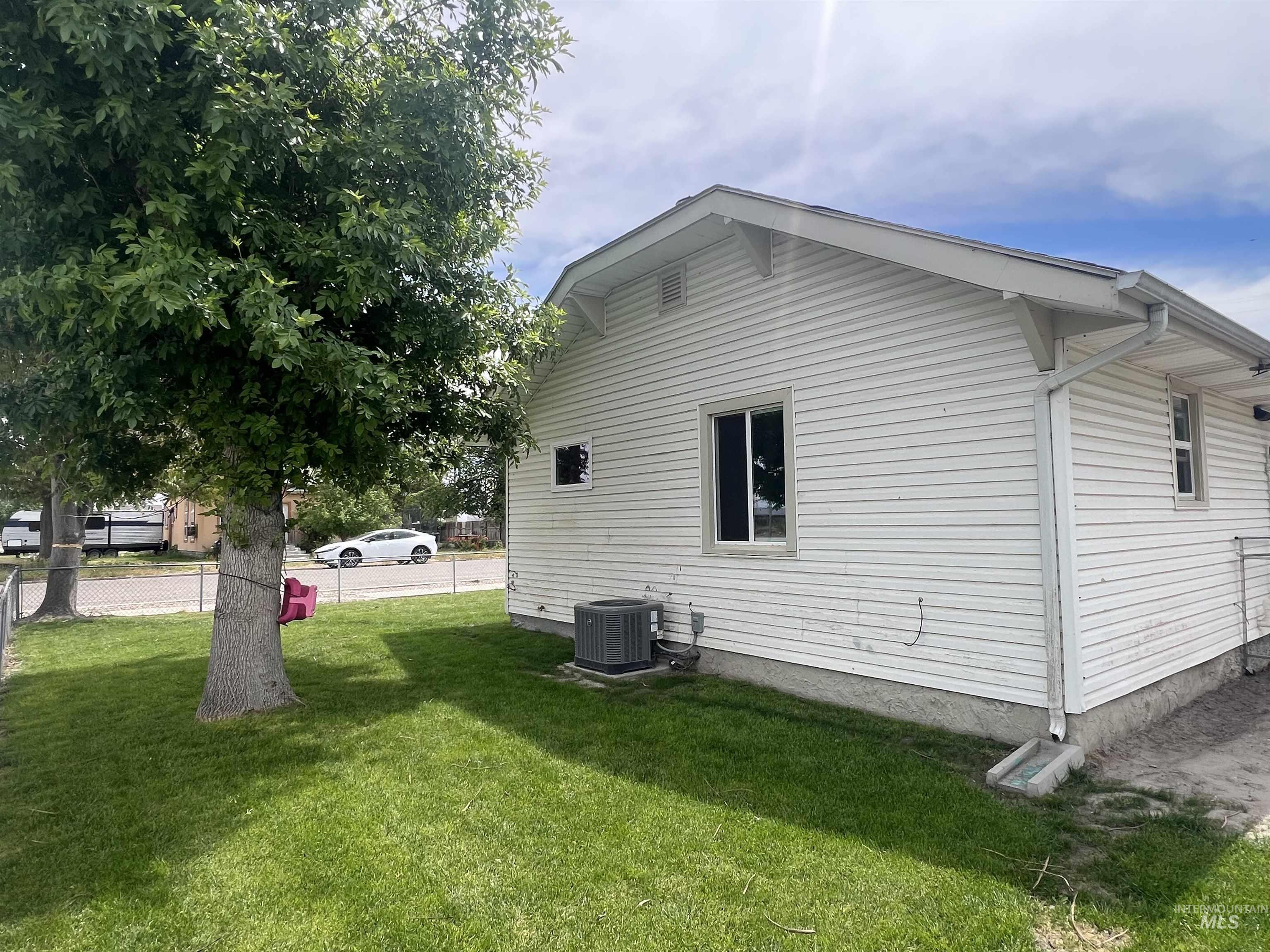 121 North 1st Street Nyssa, OR 97913 - Photo 2 of 20 White horizontal siding exterior with a pitched roofline