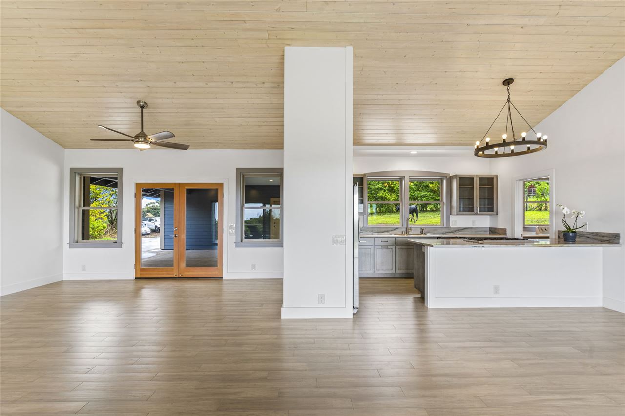780 West Kuiaha Road Haiku, HI 96708 - Photo 11 of 30 a view of a living room and kitchen with a window