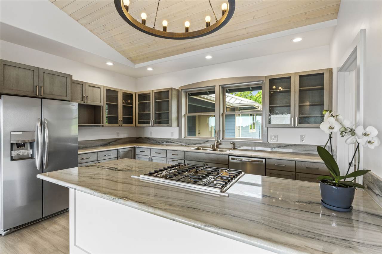 780 West Kuiaha Road Haiku, HI 96708 - Photo 12 of 30 a kitchen with a stove a faucet and a chandelier