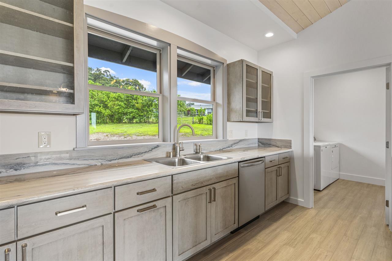 780 West Kuiaha Road Haiku, HI 96708 - Photo 14 of 30 a kitchen with a sink and a window