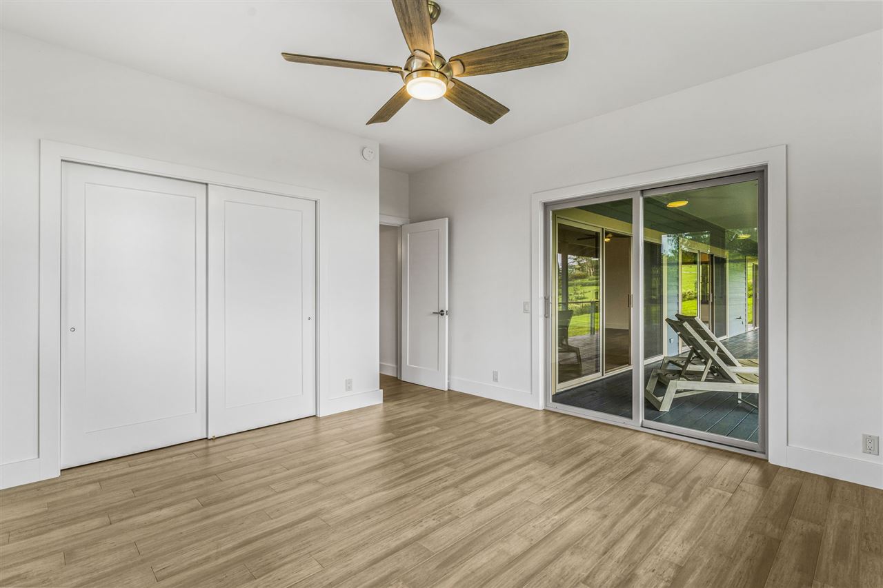 780 West Kuiaha Road Haiku, HI 96708 - Photo 24 of 30 wooden floor in an empty room with a window