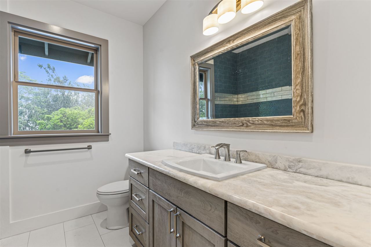 780 West Kuiaha Road Haiku, HI 96708 - Photo 25 of 30 a bathroom with a toilet sink and mirror