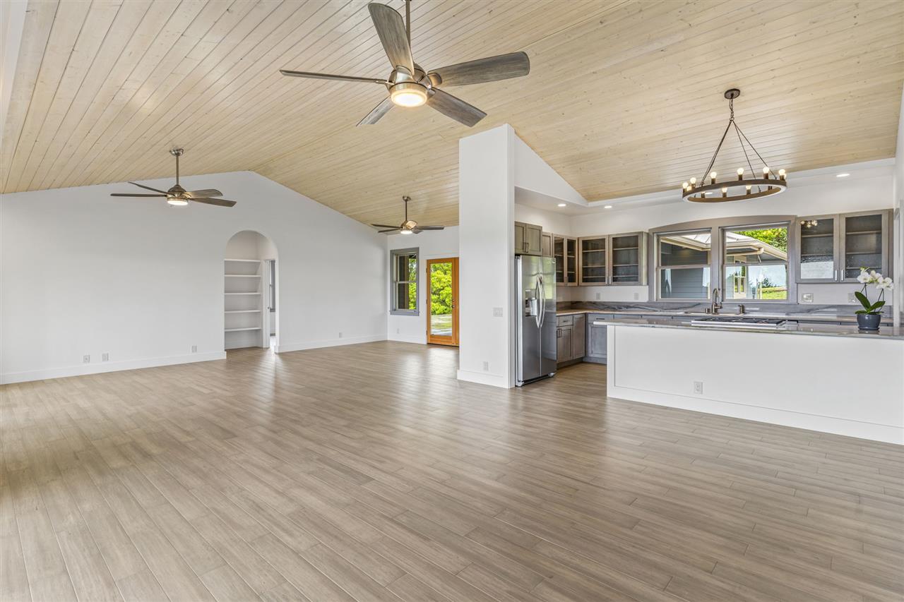 780 West Kuiaha Road Haiku, HI 96708 - Photo 5 of 30 a view of a kitchen with a sink stainless steel appliances and a chandelier